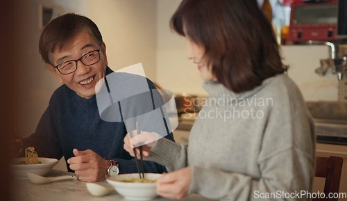 Image of Japanese couple, food and home with conversation, love and bonding together with happiness, romance and smile. Apartment, old man or senior woman with healthy meal, nutrition and cheerful with dinner