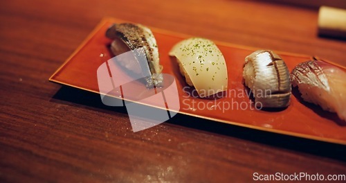 Image of Tuna, restaurant and japanese sushi for fish, raw salmon and healthy food on plate for asian culture. Japan, cuisine and rice for vitamins on table and lunch by catering of seafood menu for nutrition