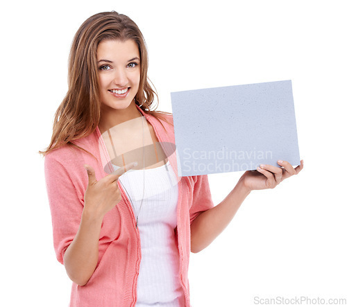 Image of Portrait, woman or pointing to space on board, presentation or advertising poster, broadcast deal or commercial in studio on white background. Happy model, paper mockup or feedback of review about us