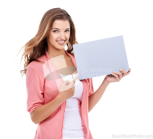 Image of Portrait, happy woman or pointing to space on poster, presentation or advertising board, broadcast deal or review in studio on white background. Model, mockup sign and feedback of commercial about us