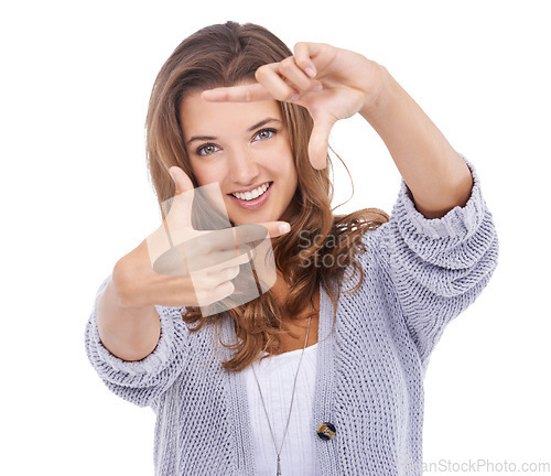 Image of Woman, portrait and finger frame in studio to review profile picture, composition or creativity on white background. Happy model, hands and planning perspective of face, photography or perfect selfie