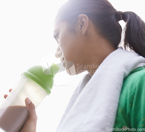 Image of Sports, drink and woman with protein shake in bottle for health, wellness and energy benefits after exercise. Outdoor, fitness or person with smoothie in container for nutrition in diet after workout