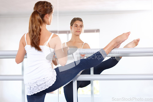 Image of Stretching legs, ballet and girl on mirror in studio, barre and student exercise. Ballerina, young teenager and reflection for flexibility training, dance choreography for performance art and fitness