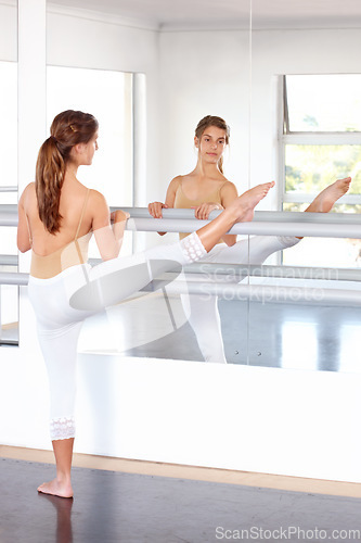 Image of Stretching legs, ballerina and girl on mirror in studio, barre and student exercise. Ballet, young teenager and reflection for flexibility training, dance choreography for performance art and fitness