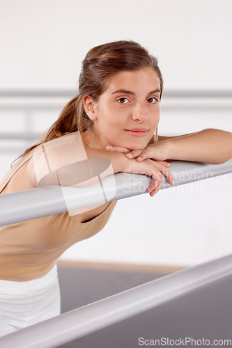 Image of Portrait, ballerina and girl on barre in studio, practice and student exercise in academy. Ballet, young teenager and training, dance choreography for art or performance for body fitness at school