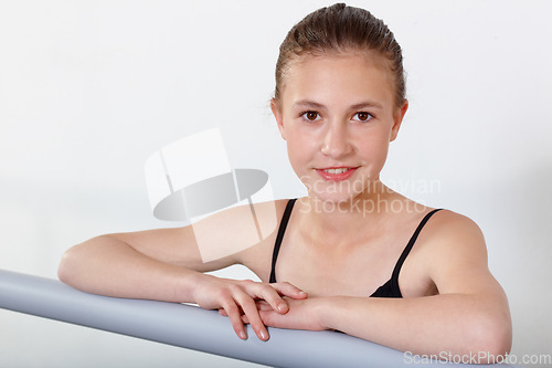 Image of Portrait, ballet and happy girl on barre in studio, practice and student exercise isolated on white background mockup. Ballerina, young teenager or training, dance choreography for art or performance