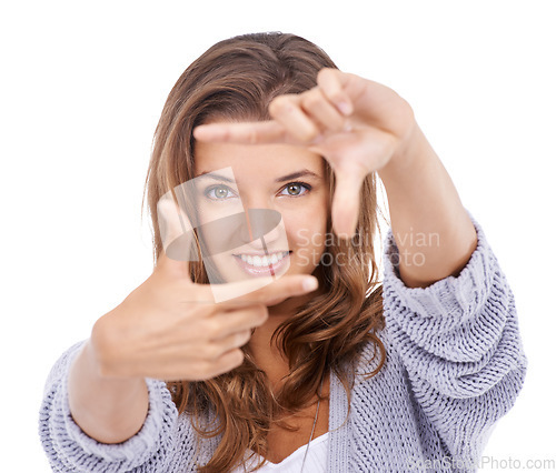 Image of Woman, portrait and finger frame in studio to review profile picture, composition or creativity on white background. Happy model, hands and planning perspective of face, photography or perfect selfie