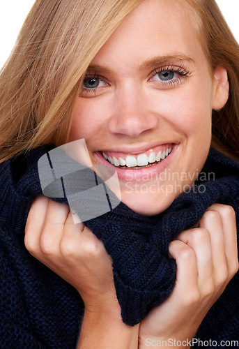 Image of Winter, fashion and portrait of happy woman in studio with cool, trendy and comfortable outfit. Face, smile and female model with texture satisfaction from cosy, style or casual clothing choice