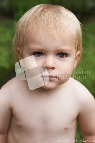 Image of Baby, standing and portrait in outdoor, development and growth for curiosity, backyard and home. Toddler, child and face in garden, alone and childhood memories for wellness, milestone and exploring