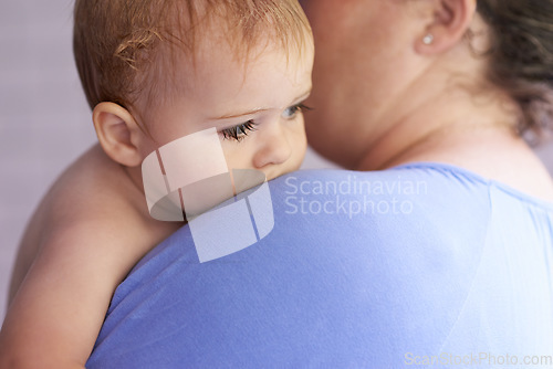 Image of Mom, comfort and holding baby with calm, sleepy or tired in home with support and care. Mother, love and carry child in arms bonding with kindness in bedroom and infant with trust in mama and family