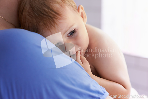 Image of Parent, comfort and holding baby with calm, sleepy or tired in home with support and care. Person, love and carry child in arms bonding with kindness in bedroom and infant with trust in family