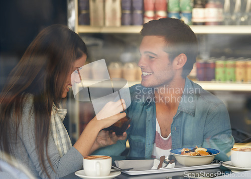 Image of Food, smile and couple eating in cafe, care and bonding together on valentines day date. Happy, man and woman in restaurant with coffee drink for breakfast, love or relationship conversation in shop