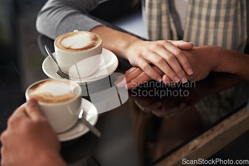 Image of Coffee cup, cafe and relax couple holding hands for support, empathy and care on morning date with caffeine beverage. Relationship, hospitality service and closeup of people bonding over drink mug