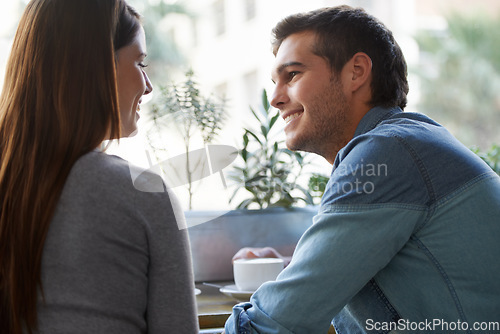 Image of Love, coffee shop and relax couple happy for romantic date, care and eye contact in diner, cafe or restaurant. Relationship, hospitality service and cafeteria man flirting with girlfriend over drinks