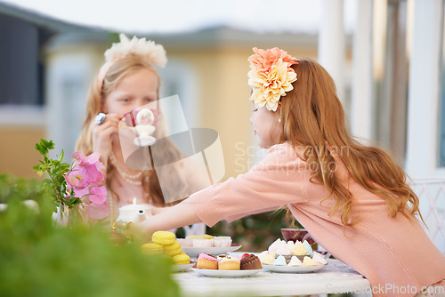 Image of Girls, children and friends at tea party outdoor for fantasy play in garden for cake, birthday or game. Kids, youth and fancy dress up in nature for summer bonding in backyard, beverage or preschool