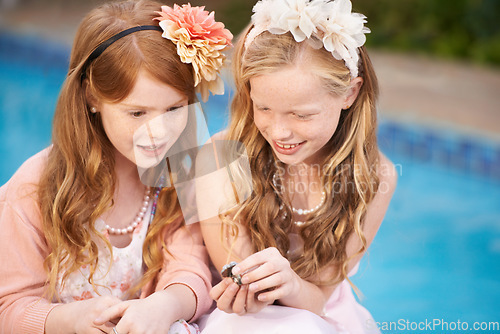 Image of Children, friends and fancy dress up clothes or costume birthday party, fantasy or play. Girls, jewelry and accessories at home or outdoor for young friendship bonding in garden, chatting or siblings