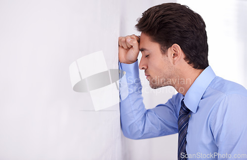 Image of Depression, business man and head on wall for financial crisis, burnout and anxiety for challenge fail. Stress, frustrated and a tired professional in bankruptcy, debt and mistake in office mockup