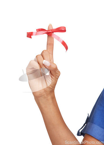 Image of Finger, ribbon and red bow on for reminder of event, commitment or sign remember task in studio. Attention, symbol and icon on hand to notice date of appointment or helping to alert memory of person