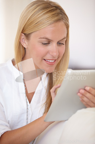 Image of Home, relax and woman with a tablet, typing and communication with internet, social media and digital app. Person, apartment and girl with technology, connection and email with a smile and network