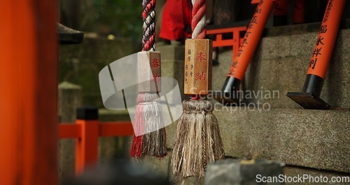 Image of Location, torii gates and temple for religion, travel or traditional landmark closeup for spirituality. Buddhism, Japanese culture and trip to Kyoto, zen or prayer on pathway by Fushimi Inari Shinto