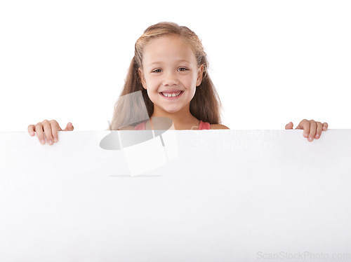 Image of Poster, portrait and child advertising space, broadcast news and commercial presentation in studio on white background. Happy girl, kid and sign board for feedback, launch and information coming soon