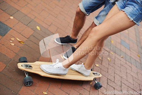 Image of Skateboard ride, legs and couple of friends teaching partner sports skills, exercise lesson or training on urban ground. Skate, cardio fitness or shoes of people helping, coaching and support balance