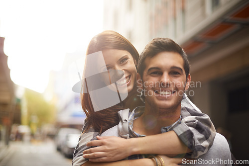 Image of Love, portrait and happy couple hug, piggyback and together for outdoor date, bonding and fun in new city. Wellness, happiness and face of gen z man, woman or people smile for relationship commitment