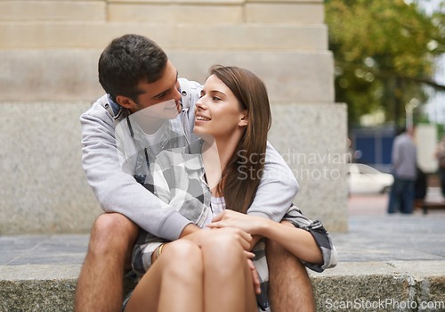 Image of City, eye contact and happy couple hug together, relax and enjoy outdoor date with care, support and romance. Urban steps, connection and people smile for relationship security, soulmate or devotion