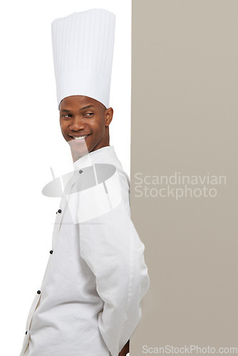 Image of Smile, man and chef on billboard menu in studio isolated on a white background mockup space. Happy, cooking and African person on poster for advertising, marketing and restaurant promotion banner
