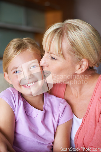 Image of Mother, girl and kiss for love in portrait, bonding and caring in childhood by single parent at home. Daughter, mommy and together in living room, embrace and security or happiness and connection