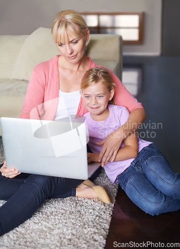 Image of Mother, child and streaming movie on laptop, internet connection and relaxing on living room floor. Mommy, daughter and subscription to entertainment, happy and website for series and online game