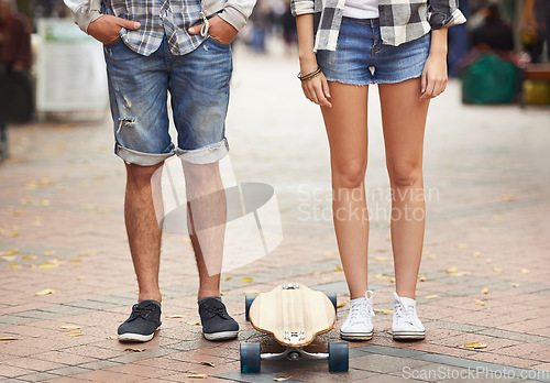 Image of Skateboard, legs and urban couple of friends ready for travel ride, outdoor exercise or skills training in city. Active, cardio fitness and feet of skateboarder for street journey, practice or skate