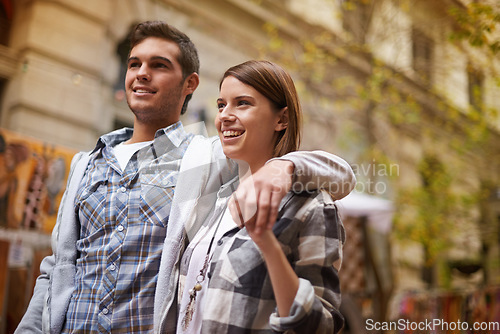 Image of Smile, hug and couple walking on city date, morning trip and vacation tour to explore urban Argentina on outdoor adventure. Love, travel and happy people bond together, relax and connect on journey