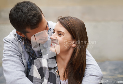 Image of Eye contact, happiness and face of couple hug together, relax and enjoy outdoor date for Valentines Day anniversary. Trust, connection and people smile for relationship security, soulmate or devotion