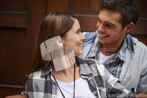 Image of Eye contact, face and relax couple smile, happy and enjoy time together for wellness, bonding and romantic connection. Commitment, love and people care for relationship partner, soulmate and comfort