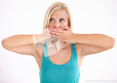 Image of Woman, thinking and cover mouth with secret about announcement in studio on white background. Wow, surprise and girl with hands on face to hush gossip or omg expression for crazy news, story or idea
