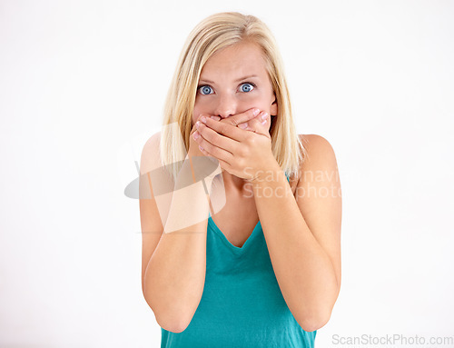 Image of Gossip, portrait and woman cover mouth in surprise for announcement in studio on white background. Wow, shocked and girl with wtf, fake news or omg expression for crazy secret, mistake or drama