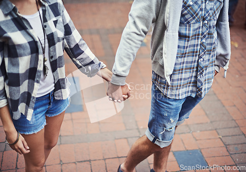 Image of Love, walking and couple holding hands on relax journey, morning trip or weekend tour for outdoor adventure. Fashion, casual clothes and romantic people commute on street, road or sidewalk floor