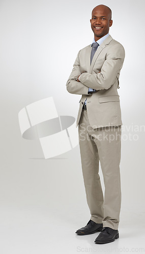 Image of Portrait, smile and business with black man, arms crossed and confident guy on a white studio background. African person, accountant and employee with a suit, startup and career with entrepreneur