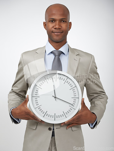 Image of Businessman, portrait and clock time for corporate professional lawyer for work deadline, hurry or punctual. Black person, face and white background in studio for company efficient, hour or mockup