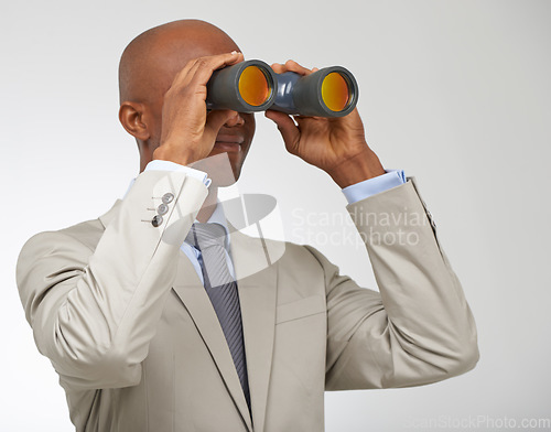 Image of Businessman, binoculars and job or search opportunity for employment, professional or white background. Male person, looking and future goals or growth at company in studio, career or mockup space