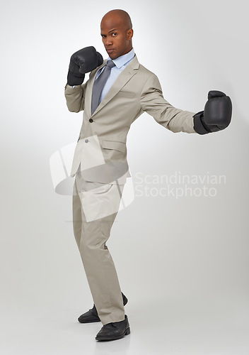 Image of Boxing, gloves and portrait of professional black man, fighter or attorney battle for justice, government law or legal work. Boxer, studio and advocate for constitution defence on white background