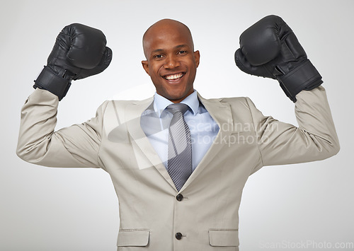 Image of Boxing gloves, portrait and black man celebrate business victory for justice achievement, legal battle or law firm success. Studio boxer, winner or advocate happy for self defence on white background