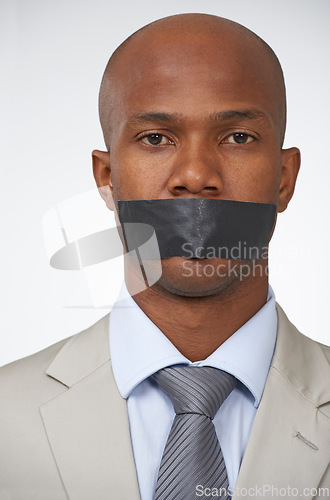 Image of Portrait, business and tape with black man, mouth covered and employee on white studio background. Face, African person or censored with secrets, silence or confidential with entrepreneur and worker