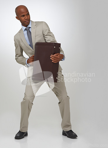 Image of Businessman, briefcase and studio as professional lawyer or prepared for opportunity, corporate or growth. Black person, suit and white background or employee ready for employment, career or mockup