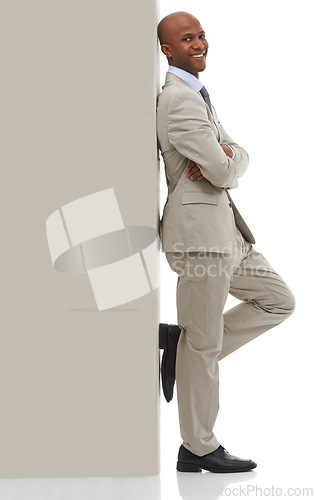 Image of Happy businessman, portrait and leaning on wall with arm crossed in confidence on a white studio background. Young black man or professional employee smile in business fashion or suit on mockup space