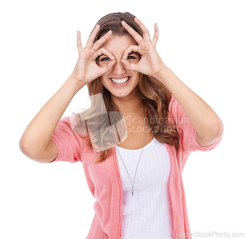 Image of Portrait, hand glasses and woman in studio with funny, silly or goofy personality on white background. Eyes, frame and face of female model with finger shape for nerd, gesture or crazy, playful mood