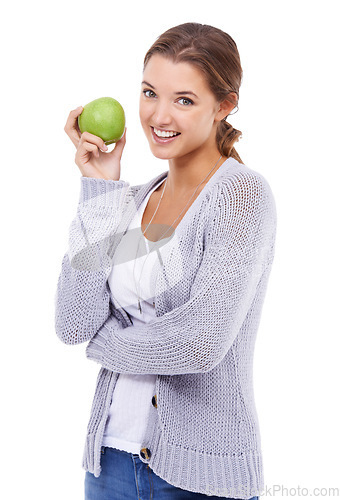 Image of Woman, portrait and apple for nutrition in studio, organic fiber and fruit for wellness. Female person, vitamins and minerals for healthy living, snack and vegan food on white background for diet