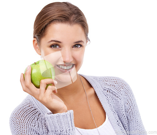 Image of Woman, portrait and apple, nutrition and gut health with snack, happy with diet for weight loss on white background. Healthy food, wellness and green fruit, vegan and organic with smile in studio