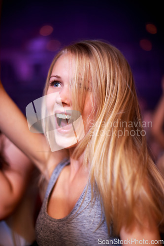 Image of Woman, dancing and music festival, happy and party in nightclub, celebrating and dj event. Disco, rock and freedom with girl dancer in crowd of fans for celebration, energy and techno performance